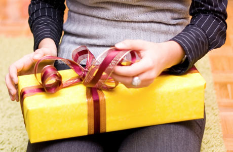 Woman-Holding-Gift-Wrapped-in-Yellow460x300
